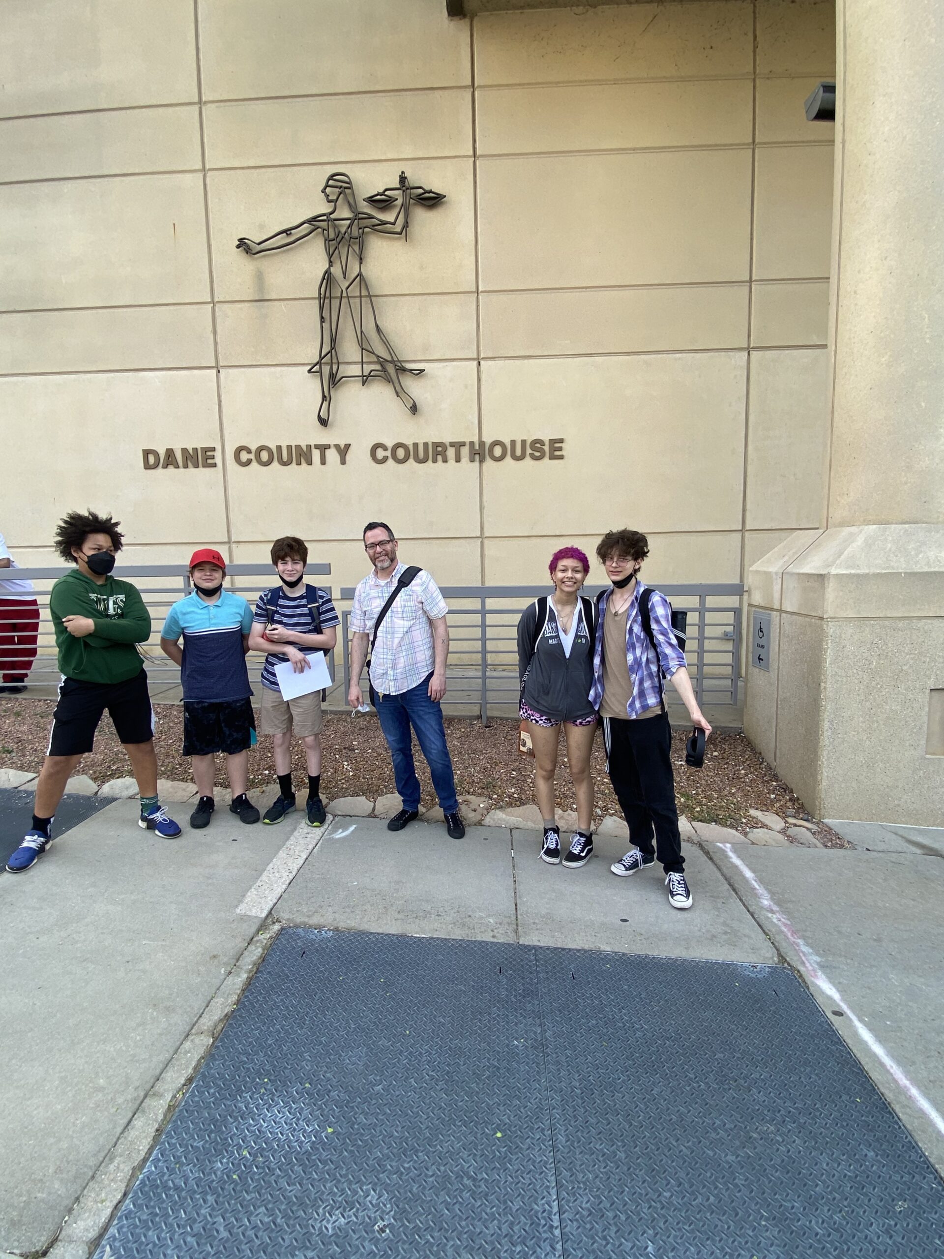 Milestone students and advisor in front of the Dane County courthouse for a student-led outing.
